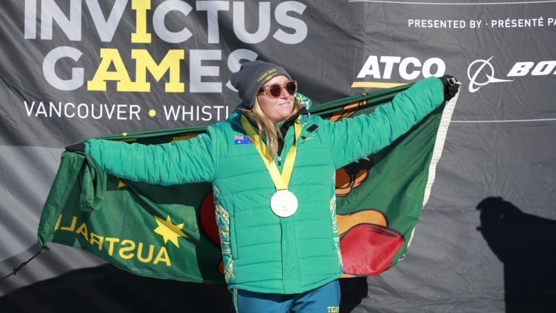 Captain Olivia Miley-Dyer on the podium after claiming gold in the Nordic cross-country skiing at Invictus Games Vancouver Whistler 2025 