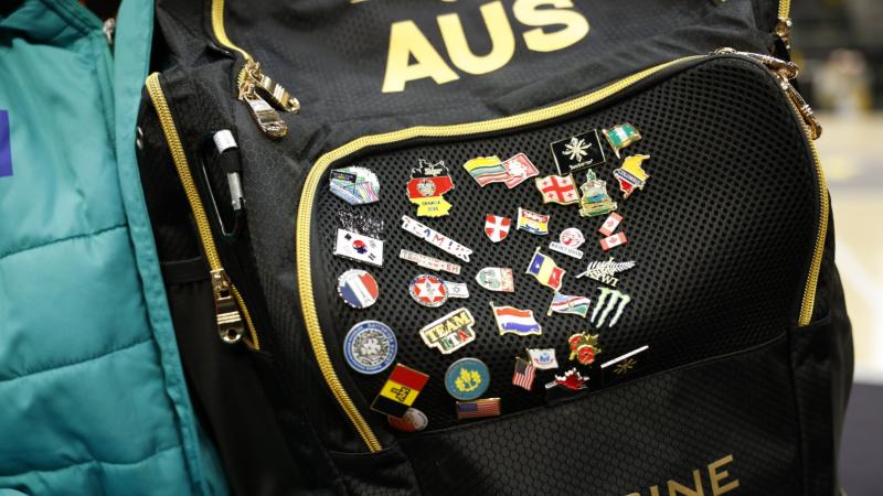 Brody Gladysz's Invictus Games Vancouver Whistler 2025 pin collection started on his lanyard and has been transferred to his team bag for space