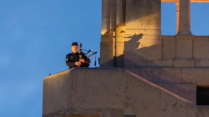 RAAF musician Corporal Robert Scott plays the bagpipes during the Anzac Day dawn service in Villers-Bretonneux, France.
