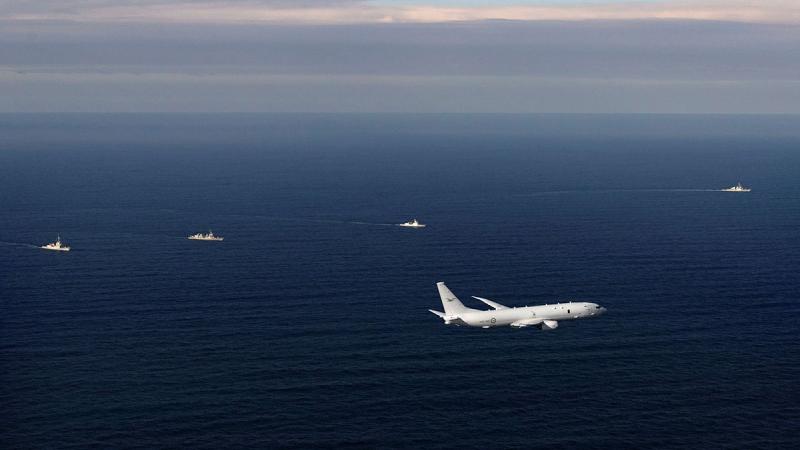 RAAF P-8A Poseidon during a maritime cooperative activity consisting of Royal Australian Navy's HMAS Hobart, Japan Maritime Self-Defense Force ship Akizuki, Philippine Navy ship BRPJose Rizal, and US Navy ship USS Benfold. 
