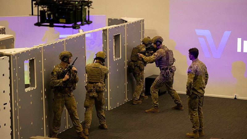 Australian Army soldiers from the 5th/7th Battalion, Royal Australian Regiment, conduct a room clearance at the close-quarter battle area of the open-plan weapon training simulation system at Robertson Barracks, Darwin.