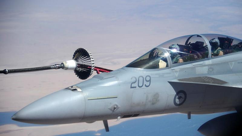 A Royal Australian Air Force F/A-18F Super Hornet aircraft receives fuel from a RAAF KC-30A Multi-Role Tanker Transport over Iraq as part of the Air Task Group for Op Okra. 