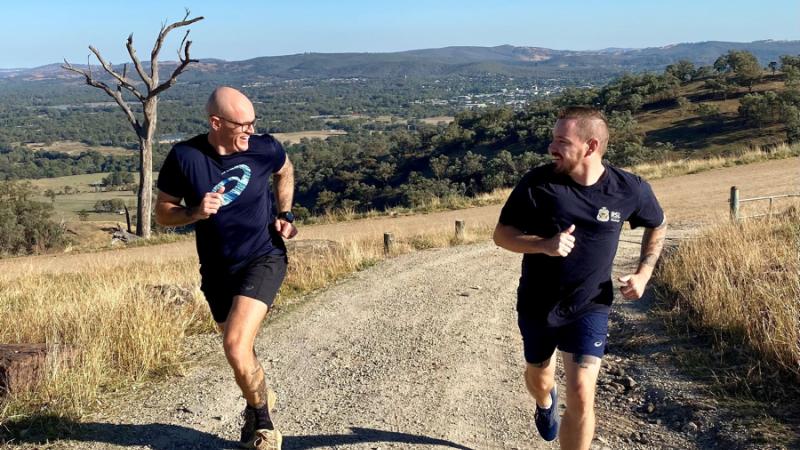 Warrant Officer Class 2 Jesse Sutherland and Wodonga RSL president Jamie Wolfe train on Huon Hill for the Meet You at the Top challenge.