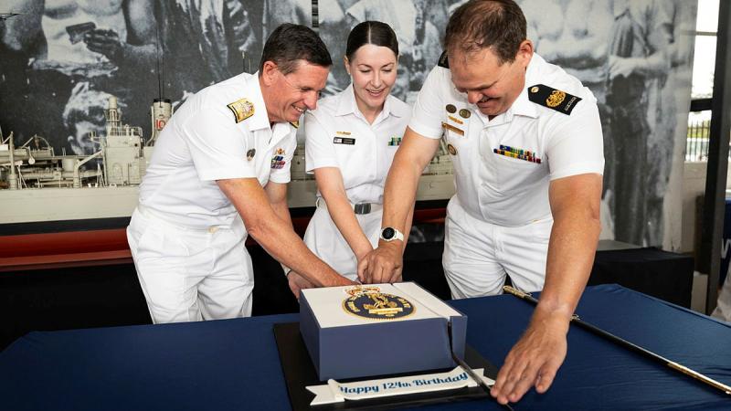 From left, Chief of Navy, Vice Admiral Mark Hammond, 2025 Sailor of the Year winner, Petty Officer Stephanie Horswood and Warrant Officer of the Navy, Andrew Bertoncin cut the Navy's 124th birthday cake at HMAS Kuttabul, NSW. 