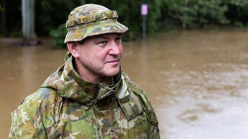 Australian Army Sergeant Paul Dennis from 41 Royal New South Wales Regiment near Lismore floodwaters while in support of the response to Topical Cyclone Alfred. 