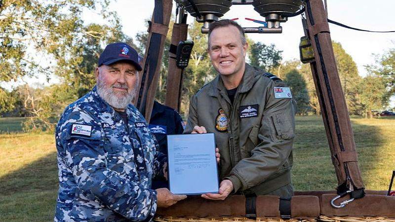 Chief of Air Force, Air Marshal Stephen Chappell, presents Warrant Officer Jeff Addinsall with the Federation Star award in appreciation of his years of service.