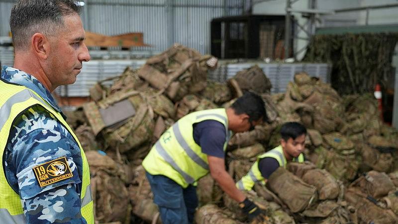 Sergeant Paul Scandura of 19 Squadron supervises Locally Engaged Civilians building aircraft pallets in support of a Rifle Company Butterworth rotation.