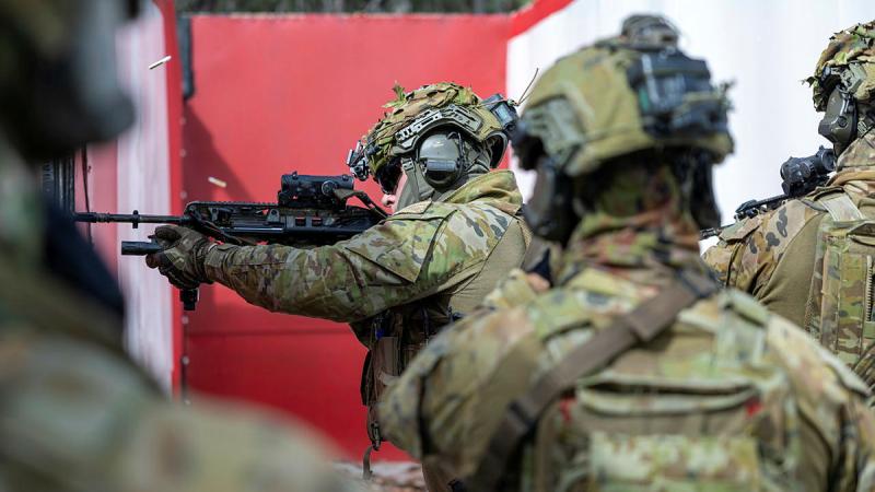 Australian Army soldiers from 8th/9th Battalion, Royal Australian Regiment conduct an urban building clearance in the deployable austere shoot house during the Urban Operations User Course at Greenbank Training Area. Photos: Corporal Michael Rogers