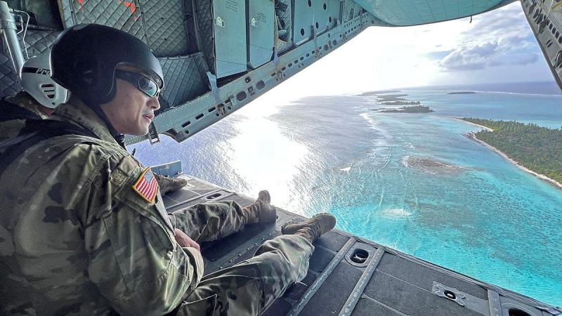 US Army personnel on the ramp of a RAAF C-27J Spartan overlooking Kwajalein Atoll.