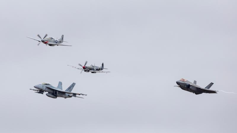 The Royal Australian Air Force's newest aircraft the F-35A Lightning II (right) and F/A-18F Super Hornet fly in formation with No. 100 Squadron CA-18 Mustang and a Supermarine Spitfire MK VIII at the Australian International Airshow 2025.