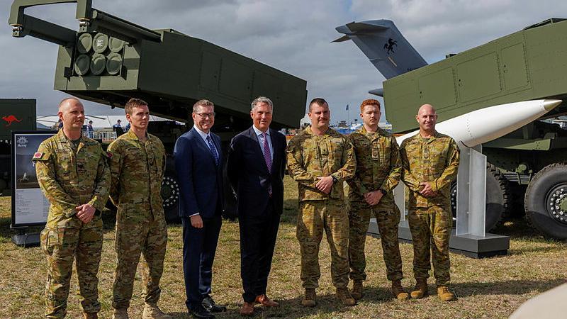 The Minister for Defence Richard Marles and Minister for Defence Industry Pat Conroy gather for a group photo with Australian Army soldiers after speaking to the media about the HIMARS at the Australian International Air Show 2025, Avalon Airport. 