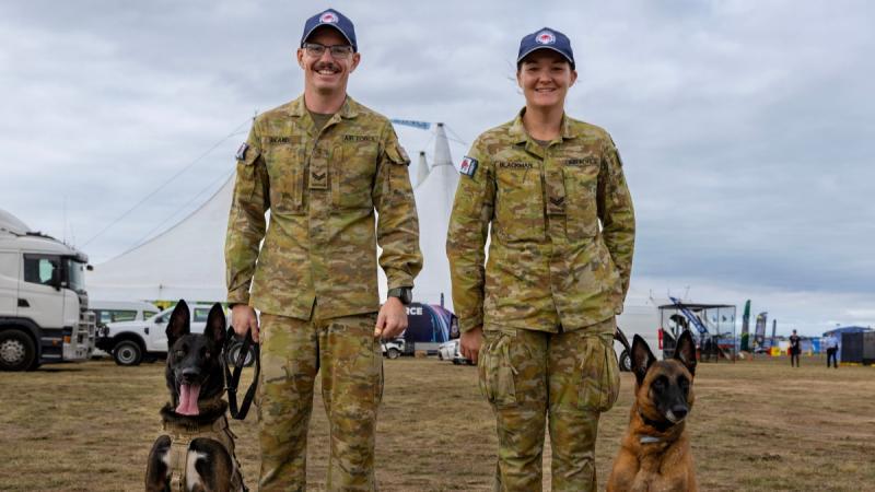 Military Working Dog Handlers from RAAF Base Tindal, Corporal Jesse Beard (Left) with his dog Xon and Corporal Natasha Blackman with her dog Onix at the Australian International Airshow 2025.