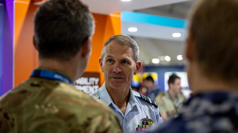 Former Jericho Director and Current Vice Chief of the Defence Force, Air Marshal Robert Chipman AO CSC, speaks with members from different allied forces marking 10 years of Jericho during the Australian International Airshow, at Avalon Airport, Victoria. Photo: Aircraftwoman Halley Van Essen