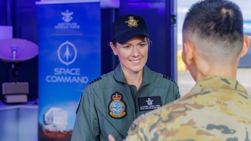 Group Captain Katherine Bennell-Pegg speaks with an Australian Army Soldier during the Australian International Air Show 2025, at Avalon Airport.