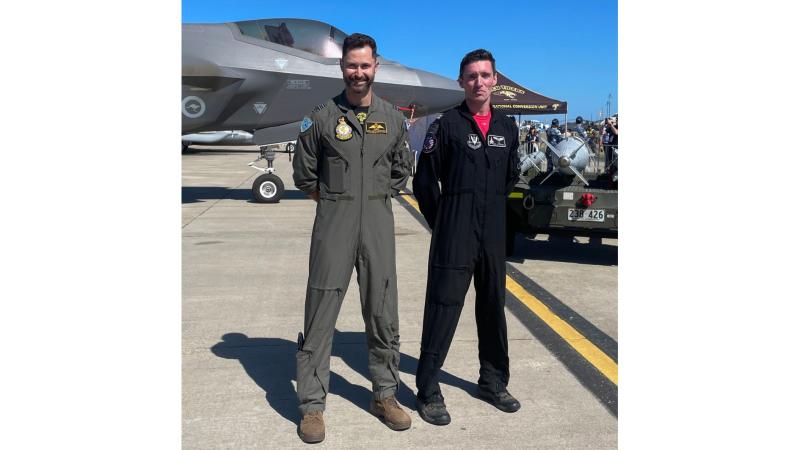 F-35 pilot, SQNLDR Paul ‘Ando’ Anderton with Captain Nick ‘Laz’ LeTourneua - commander and pilot of the F-22 Raptor Aerial Demonstration Team, in front of the F-35 static display at Australian International Airshow 2025