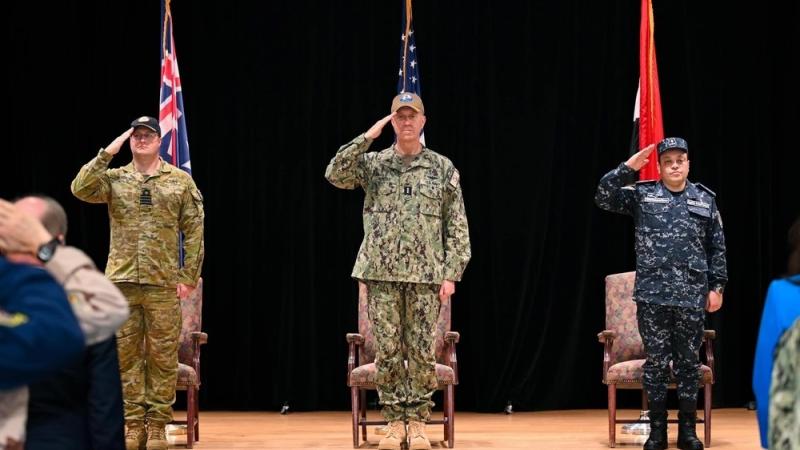 Royal Australian Navy Captain Jorge McKee, outgoing commander of Combined Task Force 153, Vice Admiral George Wikoff, commander of Combined Maritime Forces, and Egyptian Navy Commodore Mohamed Rasmy, incoming commander of CTF 153, render honours during a change-of-command ceremony in Manama, Bahrain.