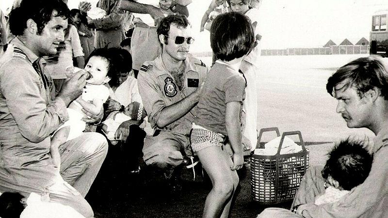 RAAF personnel caring for Vietnamese orphans of war during Operation Babylift in 1975.