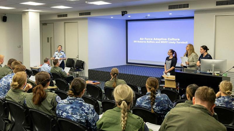 Commanding Officer of 34 Squadron, Wing Commander Sarah-Jane Leech, introduces Dr Roberta Ruffolo, left, and Warrant Officer Lindy Turnbull, right, from Air Force Adaptive Culture team during the squadron's Induction Day.