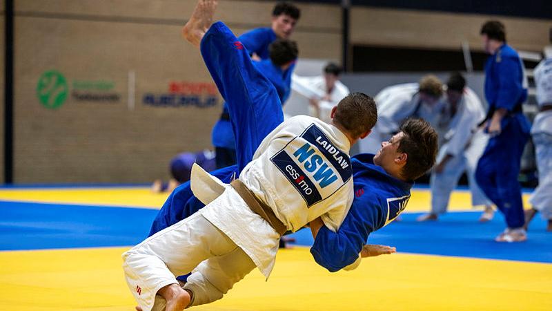Private Obian Laidlaw, in white, throws his opponent during training at the Australian Institute of Sport Combat Centre in Canberra. 