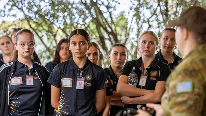 Students of the Indigenous Youth Program listen to Leading Aircraftwoman Tarlee Meany from 24 Squadron during their visit to RAAF Base Edinburgh, South Australia.