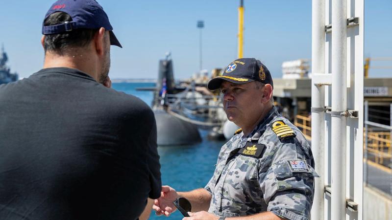 Captain Ken Burleigh, Commanding Officer of HMAS Stirling, welcomes Adriano Leon, winner of the Pirate Ship Foundation auction of a visit to HMAS Collins. 