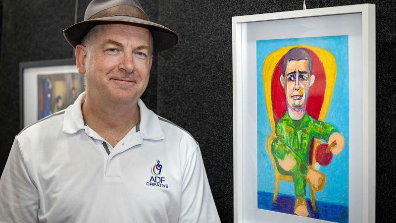 Private Keith Ross with his art piece 'Heavy is the head that wears the 381 crown' at the Defending The Arts Festival in Canberra. Photos: Corporal Michael Rogers
