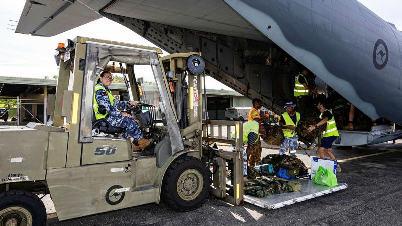 Leading Aircraftwomen Julia McDonald loads cargo onto a RAAF C-27J Spartan during the Defence Pacific Air Program in Port Moresby, Papua New Guinea. 