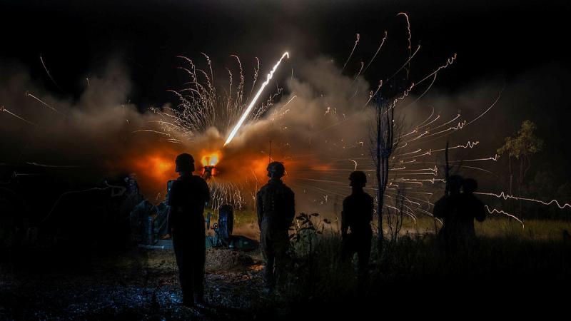 Australian Army soldiers from 4th Regiment Royal Australian Artillery fire Assegai ammunition by night in Townsville Field Training Area, Queensland. Photos: Corporal Guy Sadler