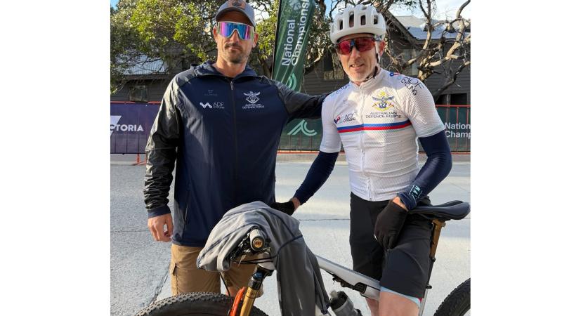 Chief Petty Officer Cameron Schmid (left) and Commander Rowan Walker at the GWM Mountain Bike National Championships at Mount Buller.