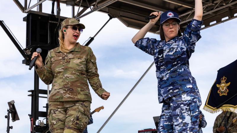 Staff Sergeant Courtney Woods, of the Pacific Air Forces Band, and Corporal Chloe Bruer-Jones, of the Royal Australian Air Force Band, perform together during the Australian International Airshow, Victoria.