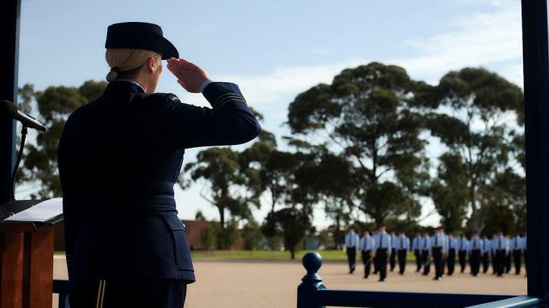 Commanding Officer OTS, Wing Commander Samantha Couper, salutes during the OTS 75th anniversary parade at RAAF Base East Sale.