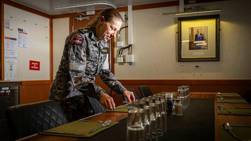 Leading Seaman Christine Merrilees, a hospitality services operator, will spend Anzac Day on board HMAS Sydney, a ship both her father and son served.