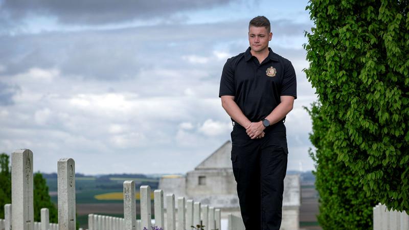 Royal Australian Navy Sailor Leading Seaman Robert Hilton of Australia’s Federation Guard pays his respects at the headstones of fallen Australian soldiers of The First World War at Villers-Bretonneux Military Cemetery, France. 