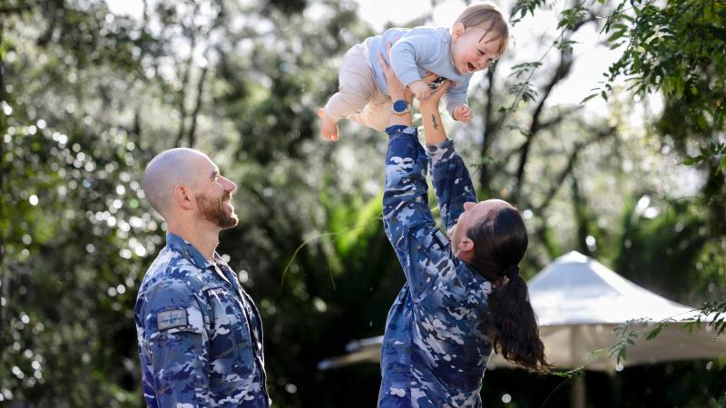 Sergeant Steven Winter and Flight Lieutenant Melinda Cannavo from 37 Squadron with their son Oliver at RAAF Base Richmond, NSW. 