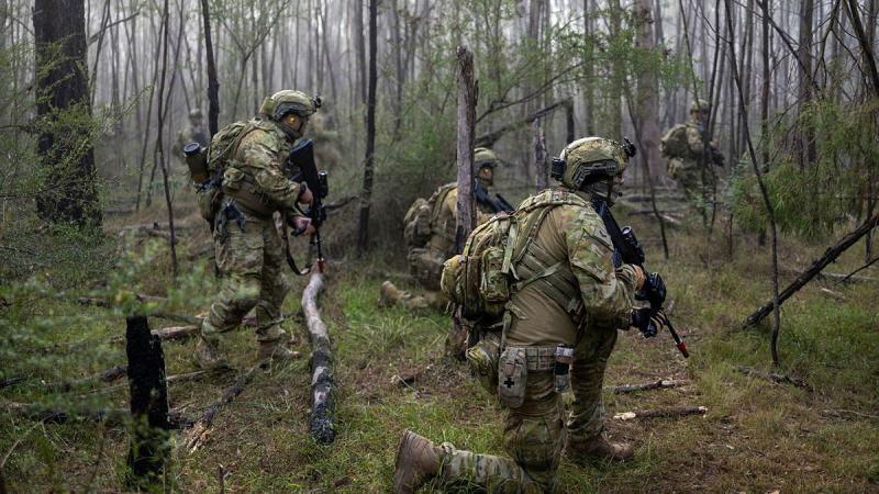 Australian Army soldiers from 1st/15th Royal New South Wales Lancers patrolling through bush at Holsworthy, NSW, during Exercise Menin Run 2025.