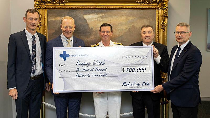 Chief of Navy Vice Admiral Mark Hammond accepts a cheque on behalf of Keeping Watch, for $100,000 from Navy Health at Russell Offices, Canberra