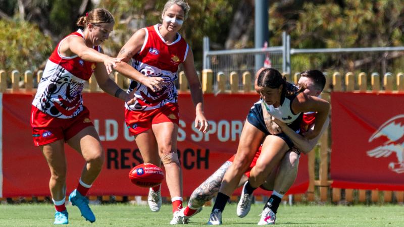 Players from the Army and Navy women’s teams compete at the annual ADF Australian Rules carnival in Melbourne.