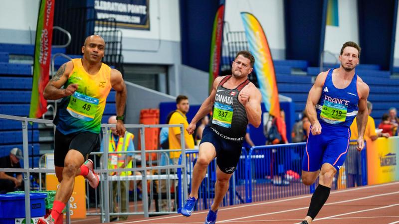 Australian Army Sergeant Nunu Campos, left, competes in a 200-metre race at the World Masters Athletics Indoor Championships in Florida, US.