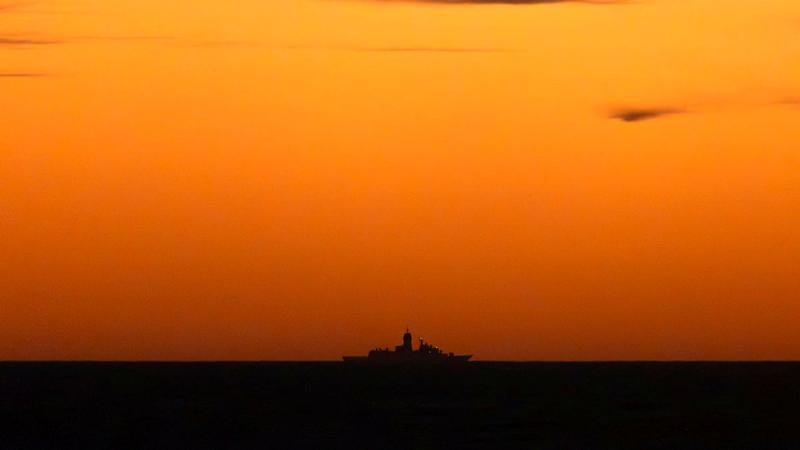 HMAS Stuart during the sunrise off Western Australia.