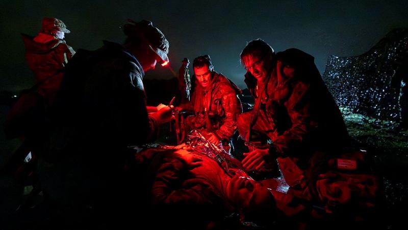 Air Force 1 Expeditionary Health Squadron personnel provide first aid to a simulated casualty during a Joint Airbase Protection Training Exercise between at RAAF Base Amberley.