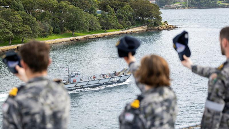 Ship’s Company HMAS Canberra cheer ship as the outgoing Commanding Officer, Captain Brendan O'Hara, RAN, leaves for the last time. 