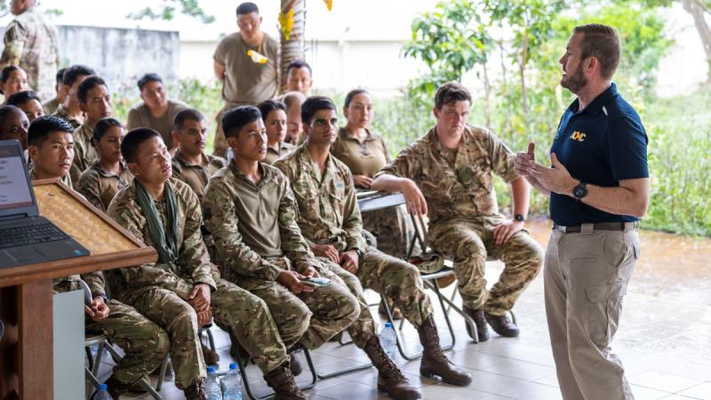 Damian Eaton, ACMC’s Assistant Director for Exercises and Plans, delivers pre-deployment briefings to the land groups preparing to deploy to Wallis and Futuna as part of Exercise Croix du Sud. 