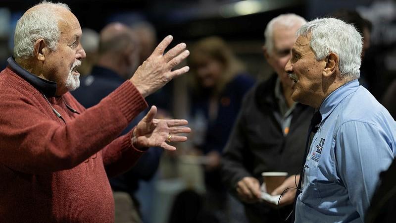 Fighterworld general manager, Air Commodore (retd) Jack Fanderlinden, right, listens as Wing Commander (retd) Hugh Holt recalls flying Hercules aircraft with him in 37 Squadron during the Vietnam War.