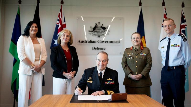 Chief of the Defence Force, Admiral David Johnston, signs the ADF Family Covenant with Defence Family Advocate of Australia, Charlotte Webb, DMFS patron, Belinda Johnston, Chief of Personnel, Lieutenant General Natasha Fox, and acting head of Joint Support Services Division, Air Commodore Patrick Keane.