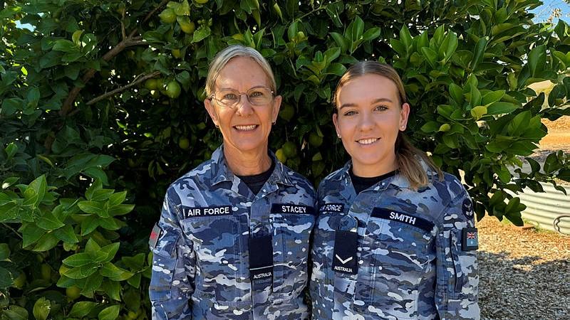 RAAF Personnel Capability Officer, Flying Officer Caroline Stacey, with her daughter, RAAF Supplier, Leading Aircraftwoman Kate Smith.