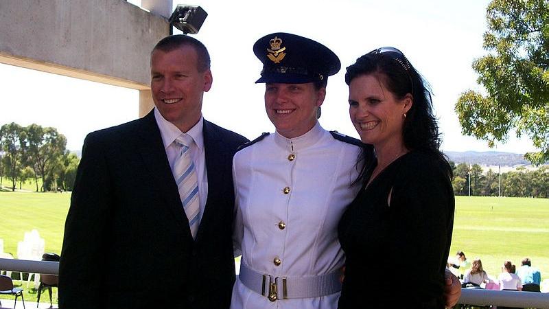 Squadron Leader Brittany Sharpe and her parents at her Australian Defence Force Academy graduation.