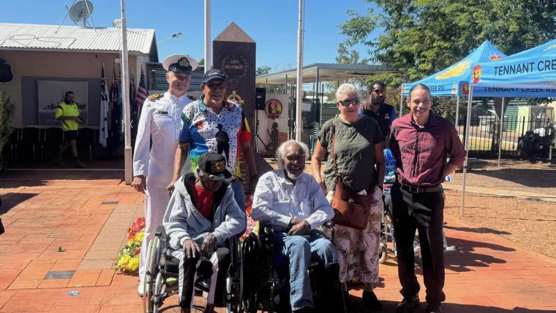 Lieutenant Commander John Scopel with Patta Aboriginal Corporation traditional owners in Tennant Creek for Anzac Day 2025.