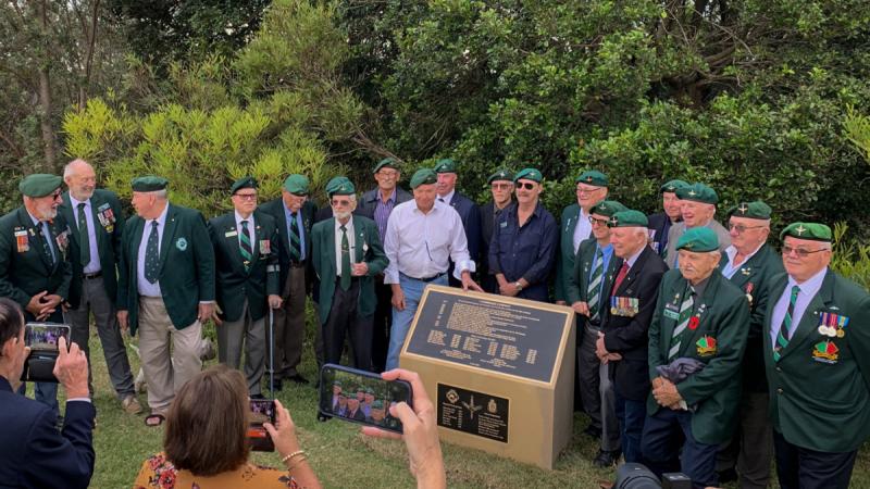 Veterans of the 1st Commando Company surround a newly unveiled plinth commemorating the Officers Commanding of the unit.