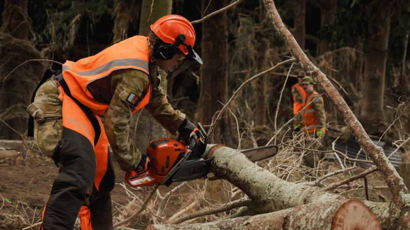 Australian Army Reserve soldiers from 5th Brigade deployed as part of Joint Task Force 629 clear debris to support the New South Wales State Emergency Service-led flood response in Wingham Brush Nature Reserve.
