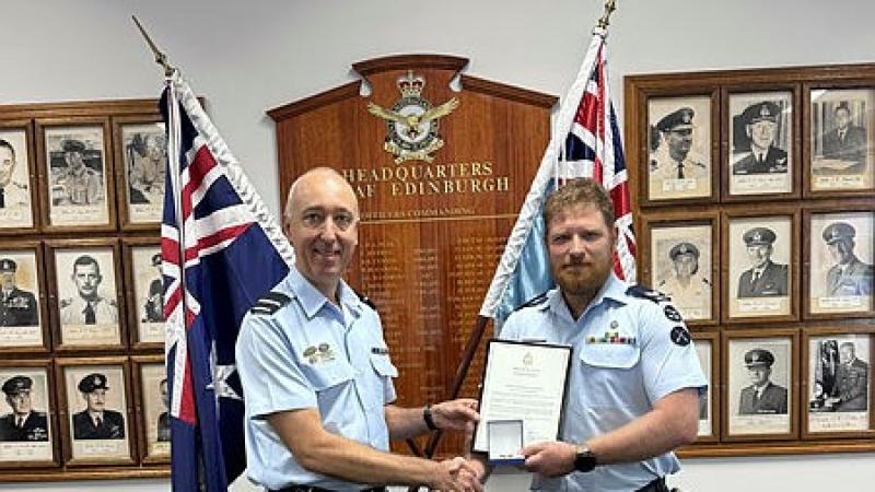 Air Commodore Martin Nussio, AM presents Corporal Chris Siles with a Chief of Air Force Gold Commendation at 24 Squadron, RAAF Base Edinburgh. 